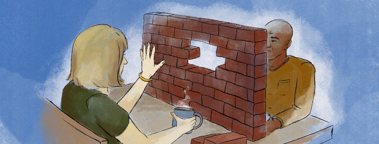Two people on a date having coffee with a brick wall between them that is being taken down